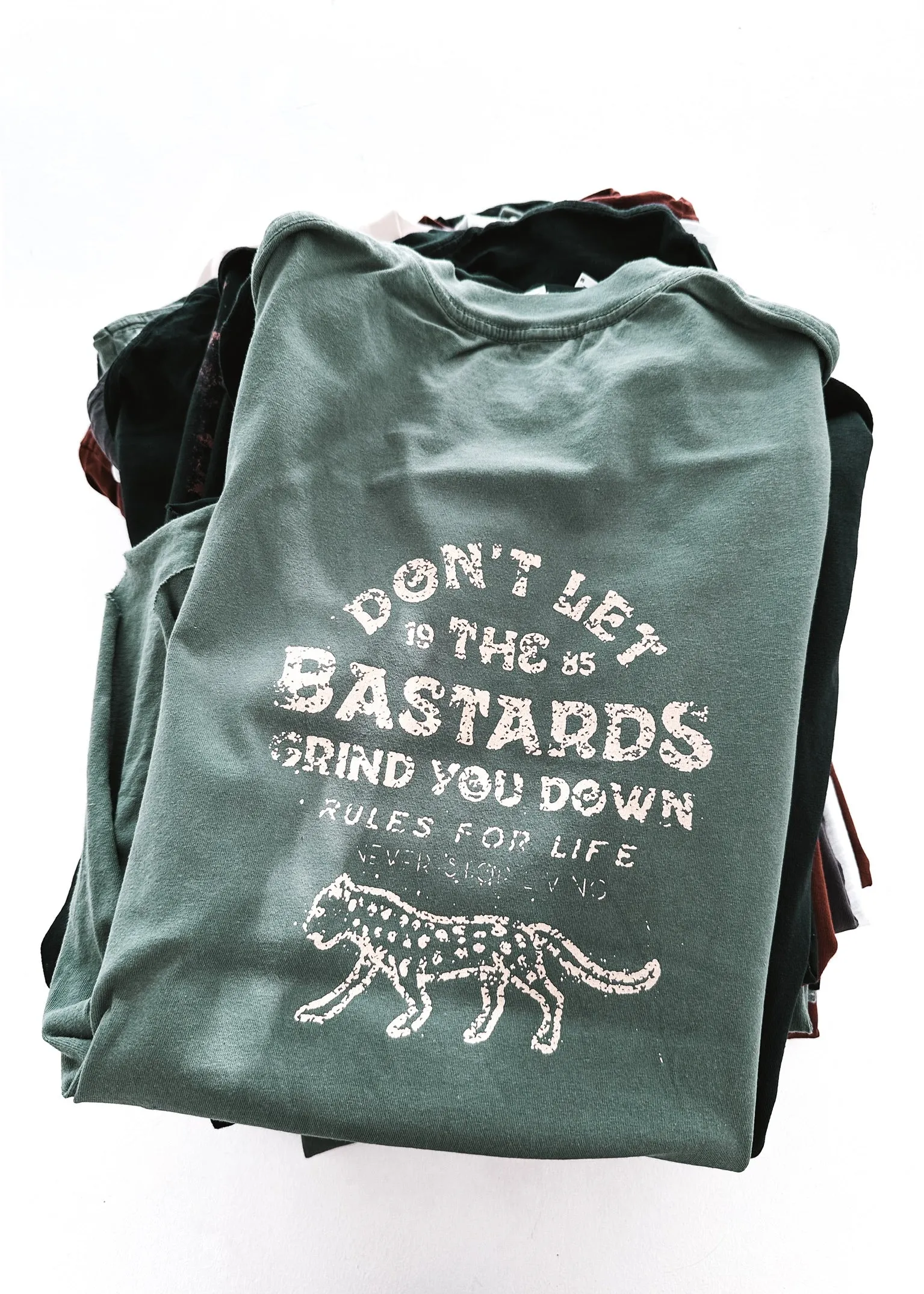 DON'T LET THE BASTARDS GET YOU DOWN SIDE SLIT TEE